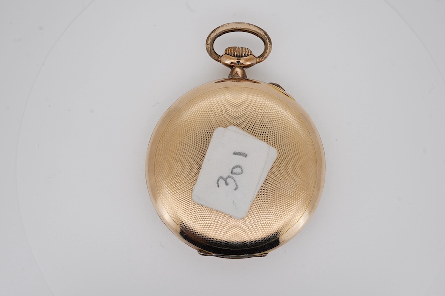 An engine turned gilt metal IWC open faced keyless dress pocket watch, with Arabic dial and subsidiary seconds, case diameter 51mm. Condition - fair to good